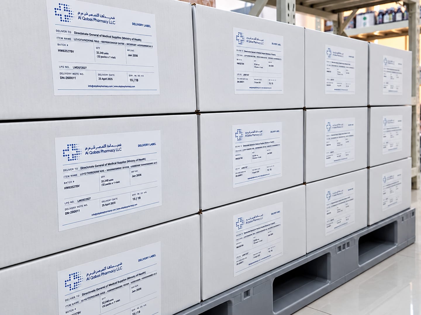 Cartons of medicines with Al Qabas delivery labels, stacked on a pallet