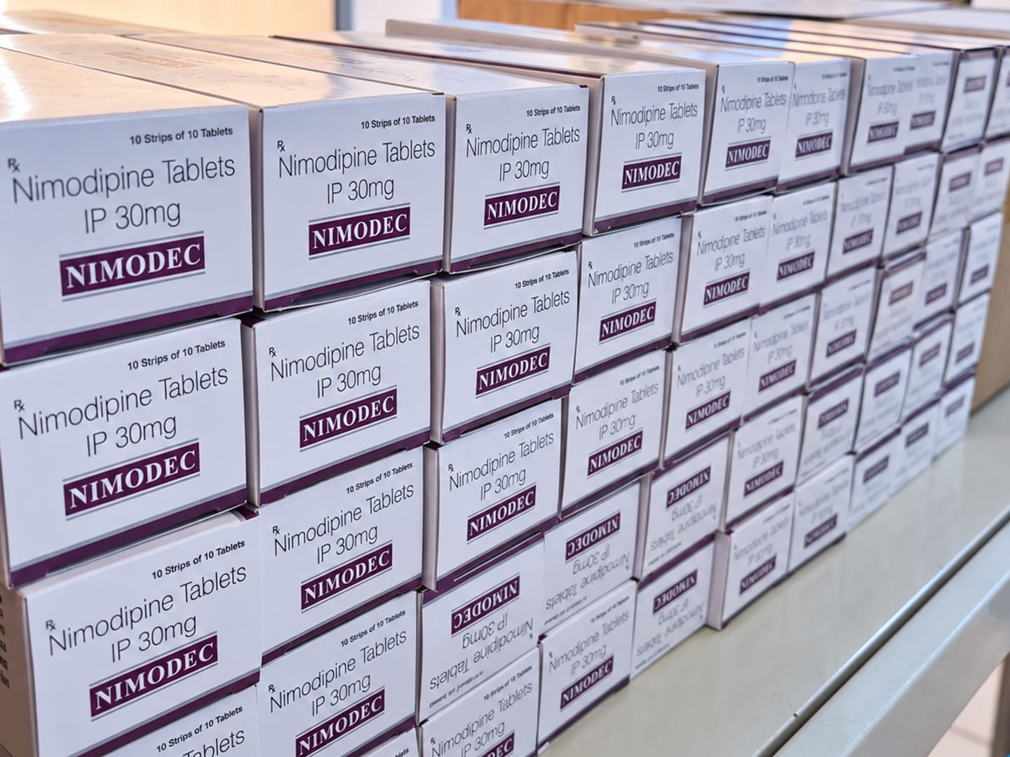 Cartons of tablets arranged on a warehouse shelf