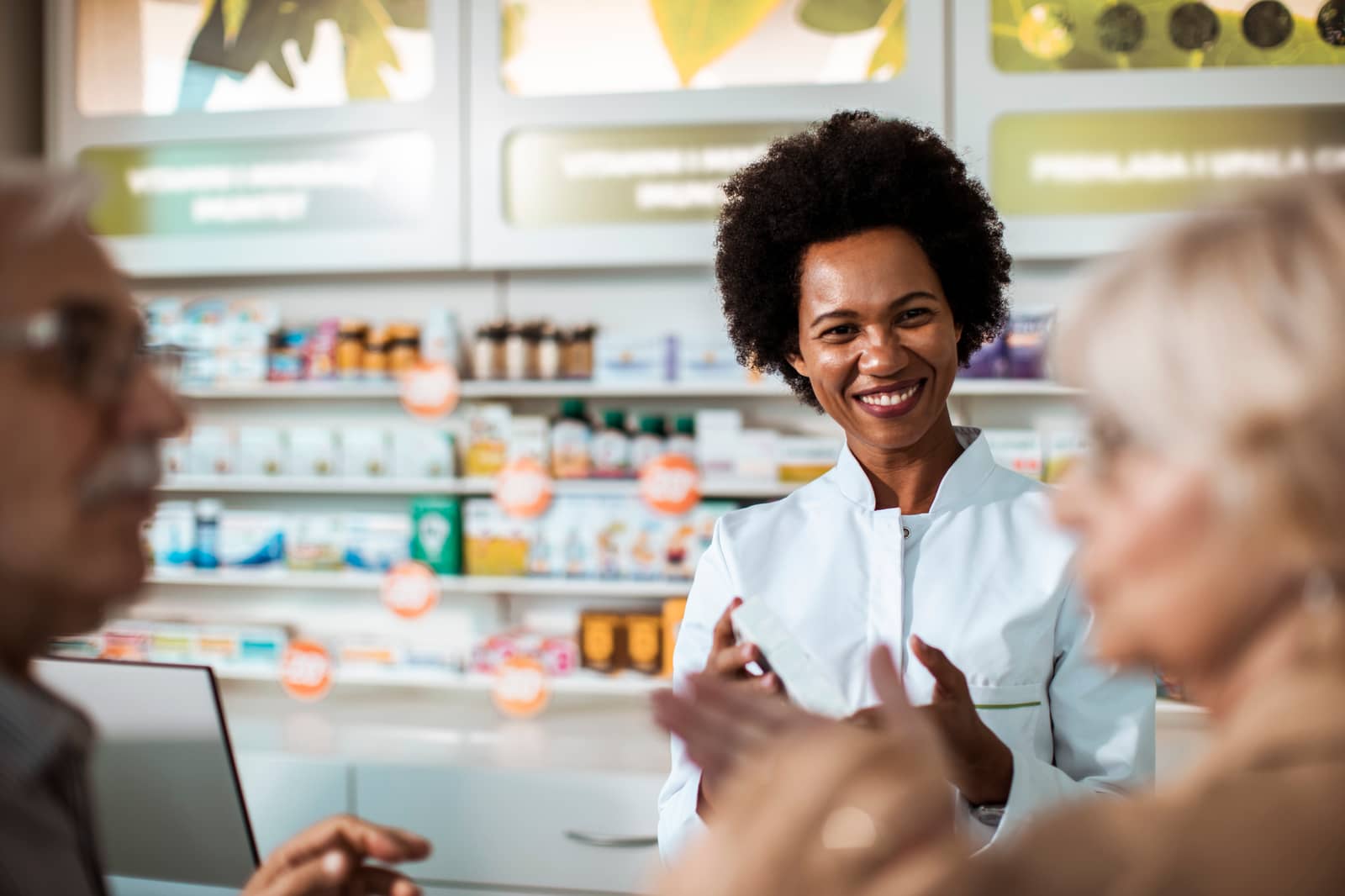 Pharmacist serving customers